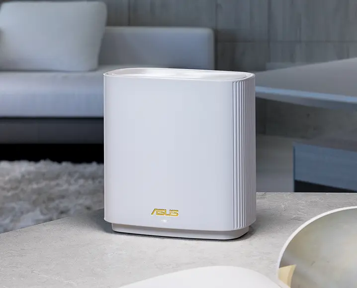 a white ASUS router on a table
